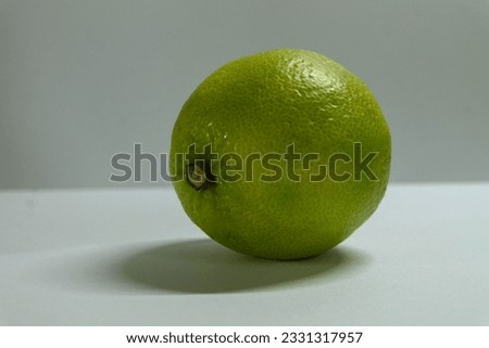 picture of a lime on a two toned background
