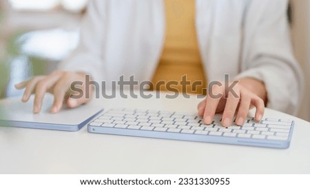 Close-up photo , using the keyboard Electronic devices working, playing social media