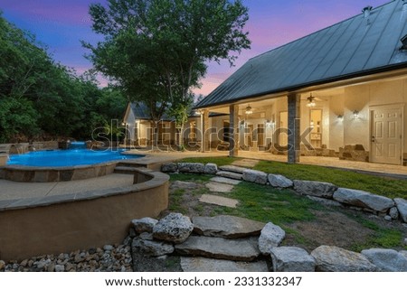 Dallas, Texas - June 17th 2023: a home back yard at sunset Royalty-Free Stock Photo #2331332347