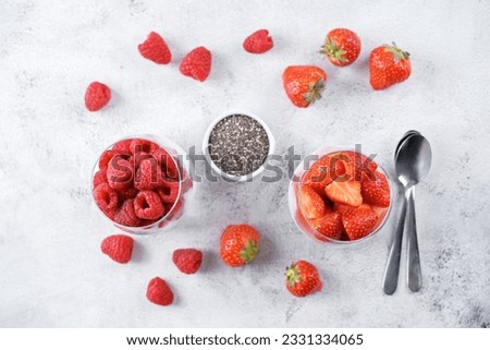 Greek yogurt Chia seeds strawberry and raspberry parfait. toning. selective focus