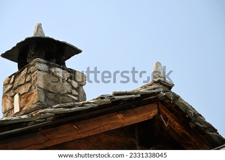 roof and chimney construction on a wooden hut