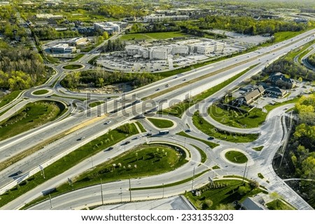 A drone view of a group of roundabouts and a highway Royalty-Free Stock Photo #2331353203