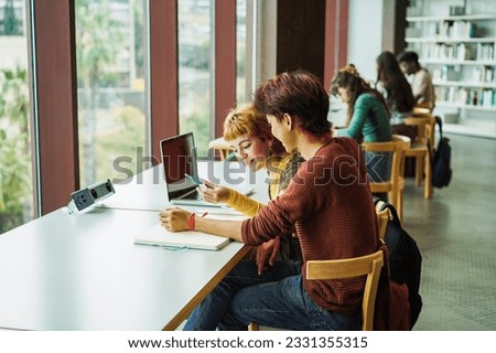 Young group of people studying inside college university library - Back to school and education concept -  Focus on student man head