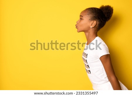Close-up profile side view portrait of her she nice attractive lovely pretty charming dreamy affectionate girl sending air kiss mom mother day isolated over yellow background