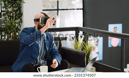 Analyst creating 3d project with vr headset, plnning development strategy with interactive vision gadget. Professional consultant in coworking space, unicorn business technology. Royalty-Free Stock Photo #2331374507