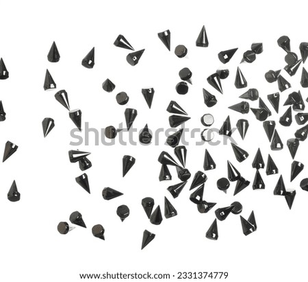 Spike Fashion decorate item explosion fly in air. Many spike black fashion blink celebrate, fashion trend decorate items explode in air, white background isolated high speed shutter freeze motion