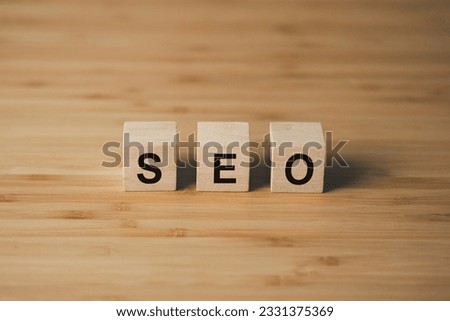 SEO Search Engine Optimization wooden cube block on wooden table. business strategy and marketing  concept