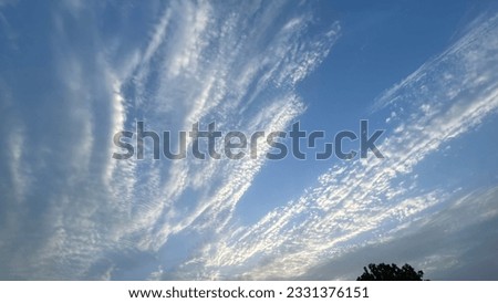 The photo showcases a mesmerizing sky adorned with an array of captivating and billowy clouds, creating a dynamic and visually stunning composition. Royalty-Free Stock Photo #2331376151