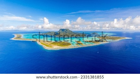 Aerial panoramic view of Bora Bora, French Polynesia and its famous lagoon located in the South Pacific Ocean Royalty-Free Stock Photo #2331381855