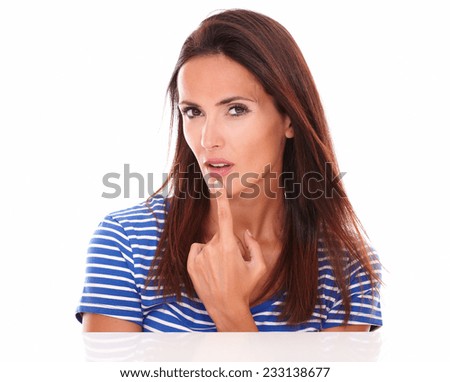 Lovely brunette looking at camera wondering about a question in white background