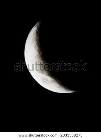 A very clear Moon picture with dark black clouds.
