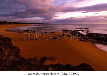 colorful sunrise on the wreck rock beach in deepwater national park near agnes water and town of 1770, gladstone region in queensland, australia; rural australia landscape, red sand beach	 Royalty-Free Stock Photo #2331394939