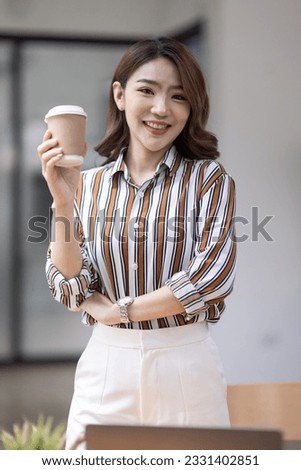 portrait of Young asian woman, professional entrepreneur standing in office clothing, smiling and looking confident, white office background
