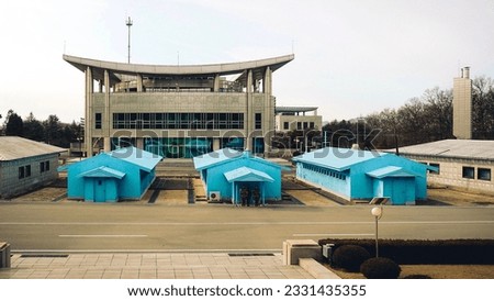 Closer-up Korean Demilitarized Zone view from Pyongyang. DMZ zone in North Korea facing South Korea, DPRK demilitarized zone with marching soldiers. Royalty-Free Stock Photo #2331435355