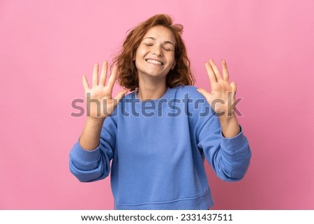 Young Georgian woman isolated on pink background counting nine with fingers