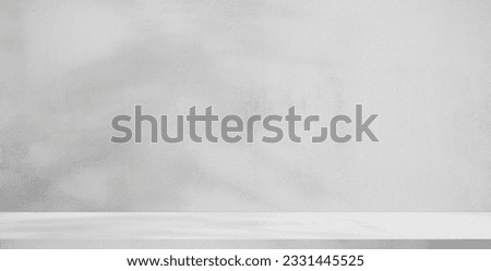 background and concrete backdrop and cement shelf showing products in black and gray , empty studio interior and with empty messages background.