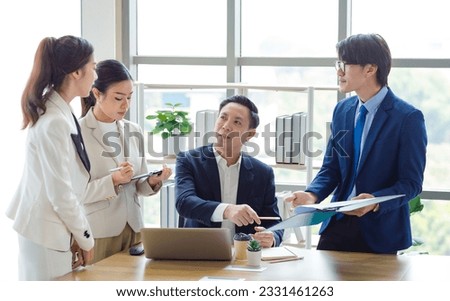 Group of Asian stressed depressed worried tired professional successful female businesswomen and male businessmen employees in formal business suit arguing disagreement about strategy in meeting room. Royalty-Free Stock Photo #2331461263