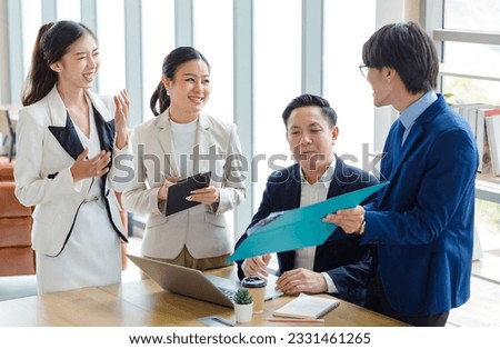 Group of Asian stressed depressed worried tired professional successful female businesswomen and male businessmen employees in formal business suit arguing disagreement about strategy in meeting room. Royalty-Free Stock Photo #2331461265