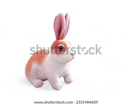 Orange white rabbit doll on white background