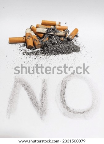 NO is written with the ashes of a cigarette. White background.Themed image for world no smoking and stop smoking campaign.
