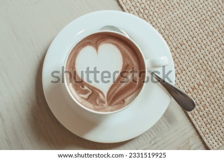 Hot chocolate cocoa drink in white ceramic cup isolated on white background. Top view. Flat lay. Clipping path.