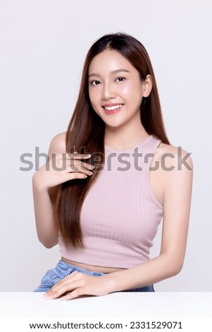 Close up beautiful longhair asian woman model with natural make up and clean fresh skin isolated on white background. Royalty-Free Stock Photo #2331529071