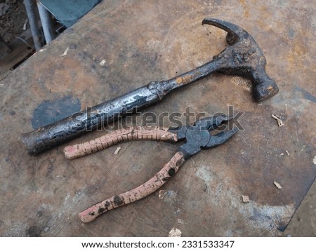 photos of used hammer and pliers tools that can still be used.