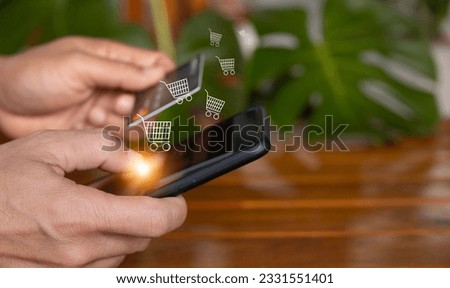 ecommerce concept female hand using smartphone and credit card with shopping cart icon