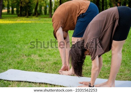 fitness couples stretching. lovely sports. fitness outdoor. family sports. yoga and martial arts