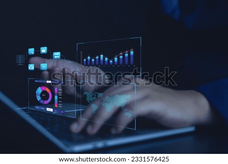 Business analytics work on computer data management systems to generate reports with KPIs and databases on financial organizational strategies, operations, sales, marketing.