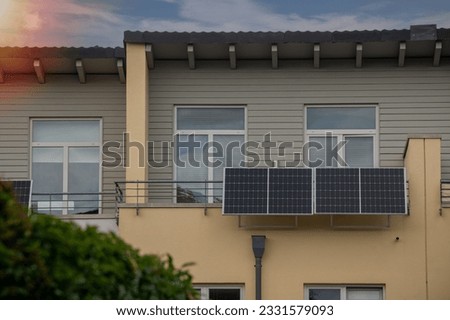 Solar power plant on a balcony  with sunlight special lens flare light effect.  Balcony solar power station eco-friendly to use renewable energy. 