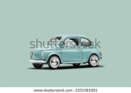 Model retro toy car on pastel blue background. Miniature car with copy space Royalty-Free Stock Photo #2331581003