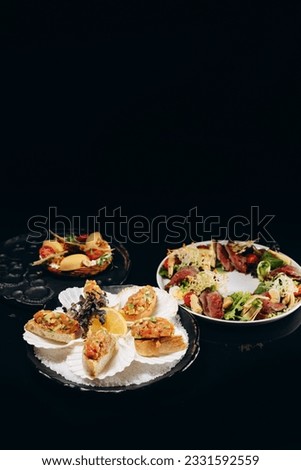 Three delicious dishes of tartar, bruschetta and salad