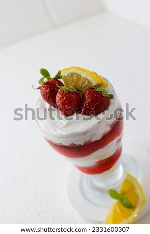 Strawberry sundae ice cream against white background. perfect for recipe, article, catalogue, or any cooking contents. 
