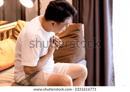 Sick middle aged man suffering from Pericarditis,Myocarditis,Cardiac Arrhythmia,severe pain in chest,difficulty in breathing,symptoms of heart attack or congestive heart failure,heart disease concept Royalty-Free Stock Photo #2331616771