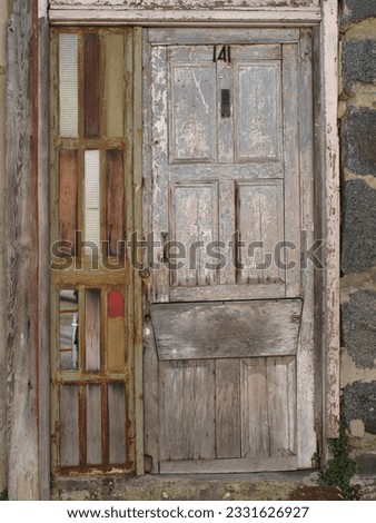 Street below the Naval Academy;  Valpari; Bass relief houses;  Cafe sign; Doorways; Graffito; Grey doorway; Street bivouac; Tangles; Window on a cat's world; Valpariso, Chile Royalty-Free Stock Photo #2331626927