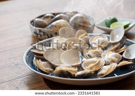 Sake-steamed clams from JapanMade in Japan, clams, steamed in sake, Japanese food, made in Kuwana Royalty-Free Stock Photo #2331641581