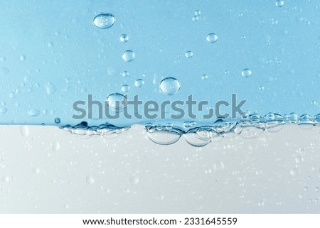 Blue transparent water oil separation makeup remover essential oil liquid Royalty-Free Stock Photo #2331645559