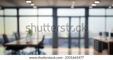 Beautiful blurred background of a light modern office interior with panoramic windows and beautiful lighting. Royalty-Free Stock Photo #2331665477
