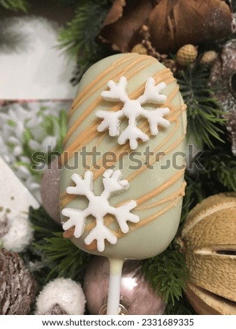 Popsicle ice cream with Christmas decoration. Ice cream cake pops with a snowflake. Sweets for Christmas holidays