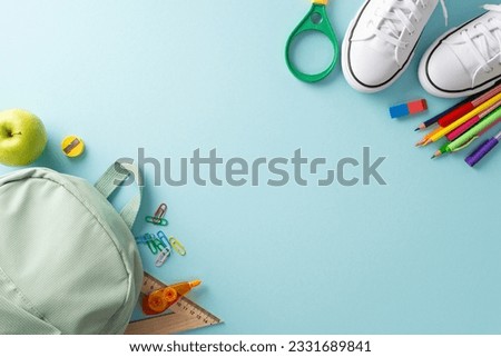 Academic preparation theme. Top-down shot showcasing backpack, sneakers and various educational materials on pastel blue background, offering ample copy-space for text or promotional content