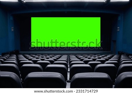 Green cinema screen and cinema chairs
