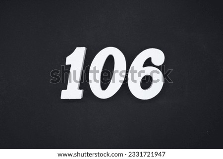 Black for the background. The number 106 is made of white painted wood.