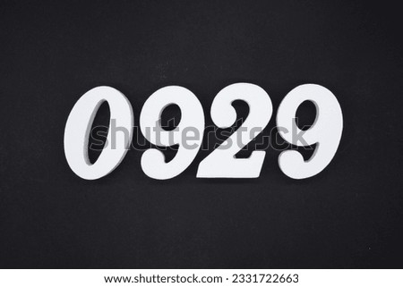 Black for the background. The number 0929 is made of white painted wood.