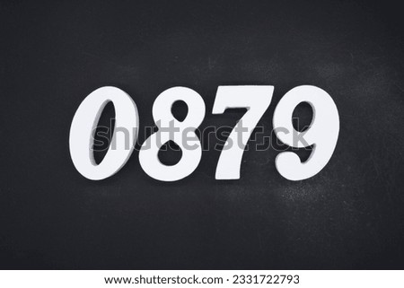 Black for the background. The number 0879 is made of white painted wood.