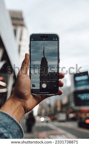 a person taking a picture of the empire building
Download this free HD photo of new york city, ny, usa and new york in New York, United States