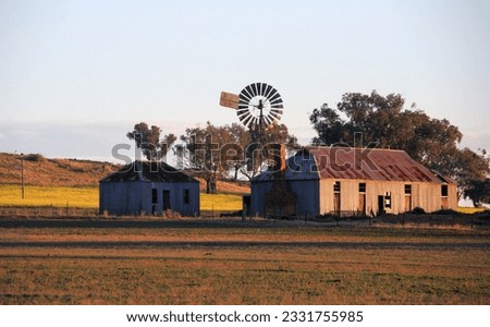 Old farm outbuildings in the warm late afternoon light of day.