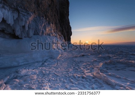 Coast of lake Baikal in winter, the deepest and largest freshwater lake by volume in the world, located in southern Siberia, Russia Royalty-Free Stock Photo #2331756377