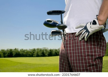 Golf club- golfer moving to the next hole