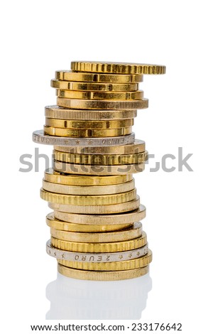 stack of money coins in front of white background, symbol photo for saving, thrift, small savers